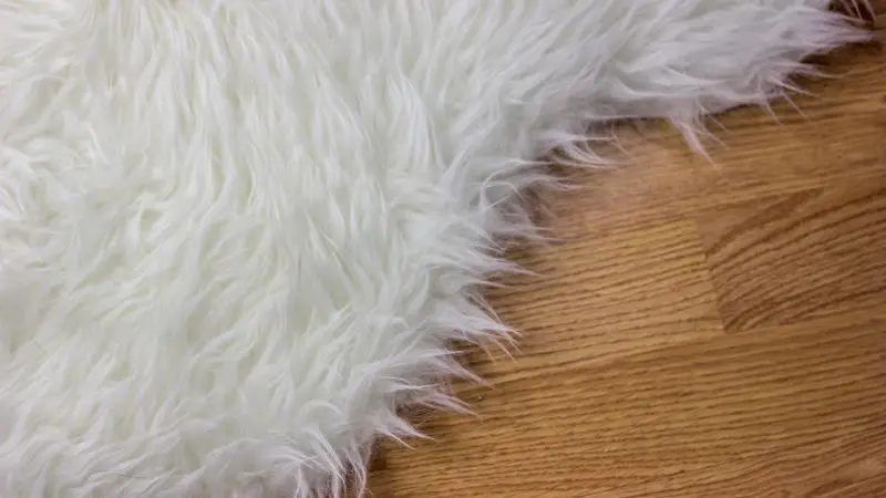 Faux Fur rug on wood